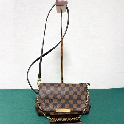 路易威登最喜爱的 PM Damier Ebene Damier 帆布单肩包。参考编号：1993。