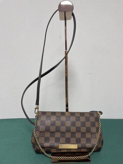 路易威登最喜爱的 PM Damier Ebene Damier 帆布单肩包。参考编号：1993。